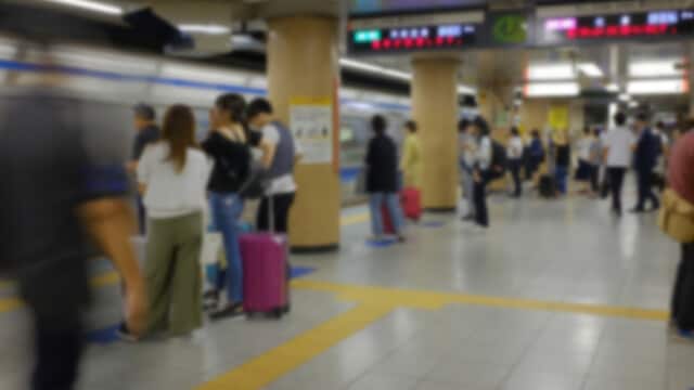 Blurred image of interior underground transit platform.
