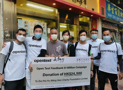OpenText employees donating to a food bank