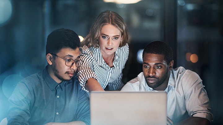 Three people having a brainstorming session