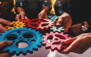 person holding gears