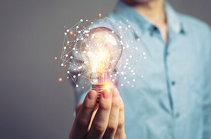 man holding lightbulb