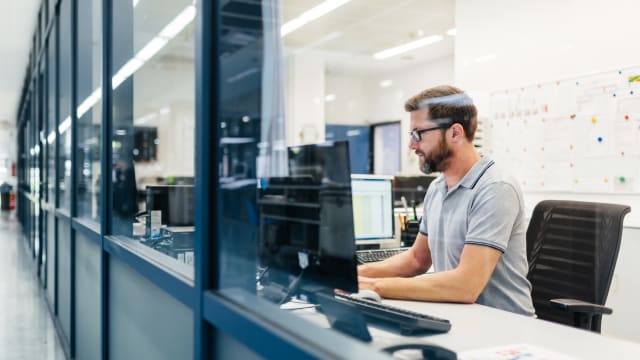 Person working at their workstation