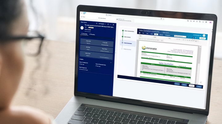Person viewing an OpenText software dashboard on a laptop
