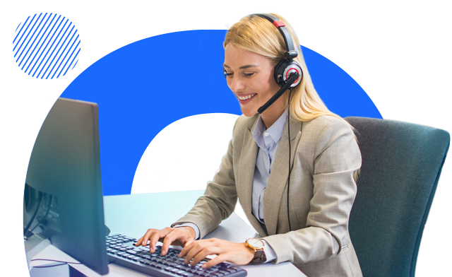 Salesperson wearing headset typing on computer