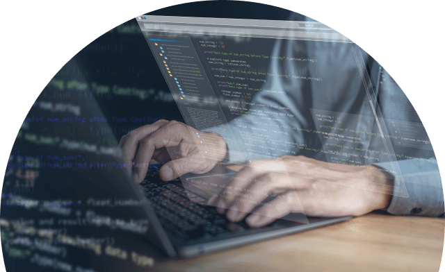 Person typing on a laptop with computer code overlaid on the screen