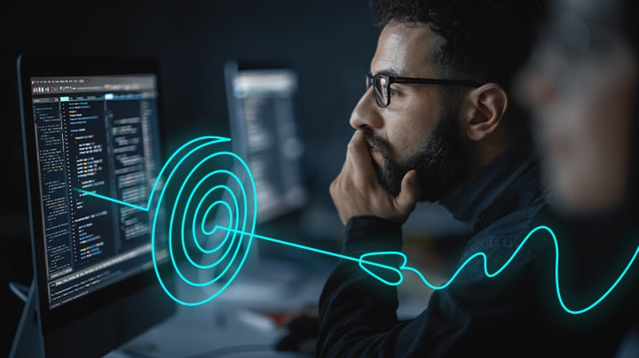 Developer looking at screen, focusing on a problem