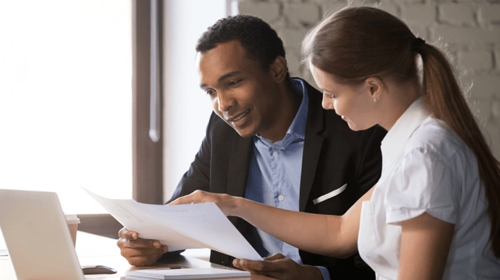 Business people working together/shaking hands or business person looking at computer