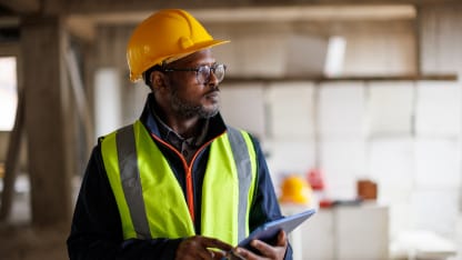 Energy industry project manager in safety gear