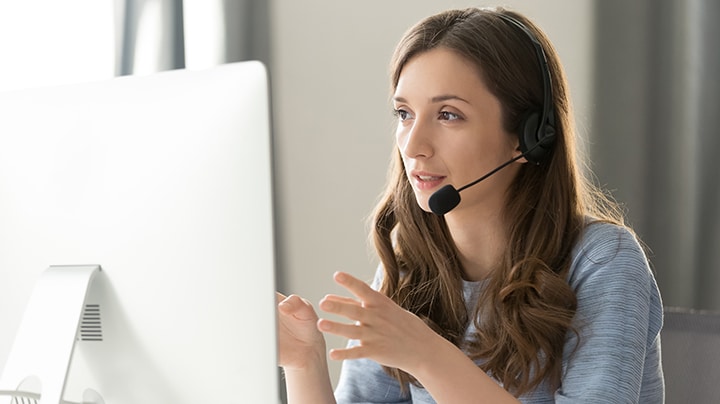 Customer service agent working on computer.