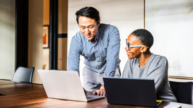 Two people working in an office