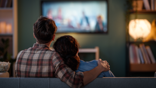 Two peoples watching TV