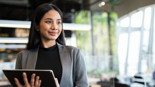 Employee smile holding tablet