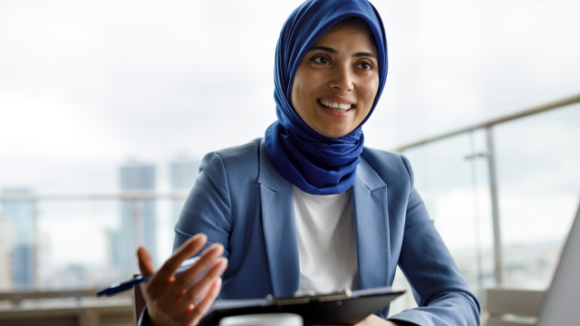 Person smiling on computer screen