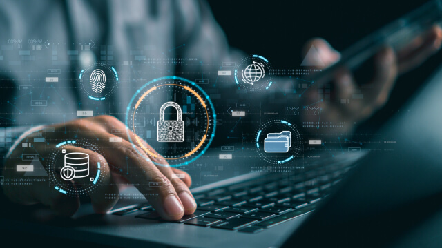 A person working on a laptop with security icons overlay