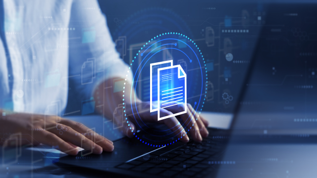 Person using laptop with digital document icons
