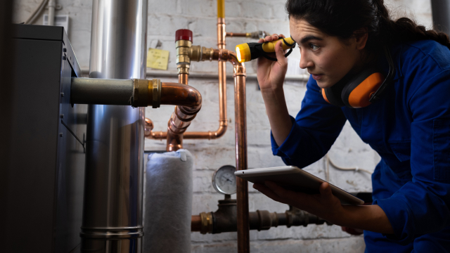 A person inspecting a natural gas facility
