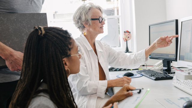 Clinical researchers discussing test results