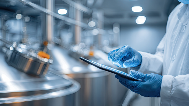 A person working on tablet in manufacturing unit