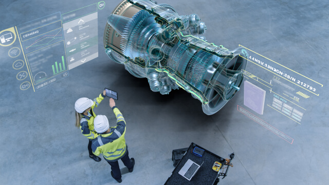 Two people using data and analytics to fix a plane’s part