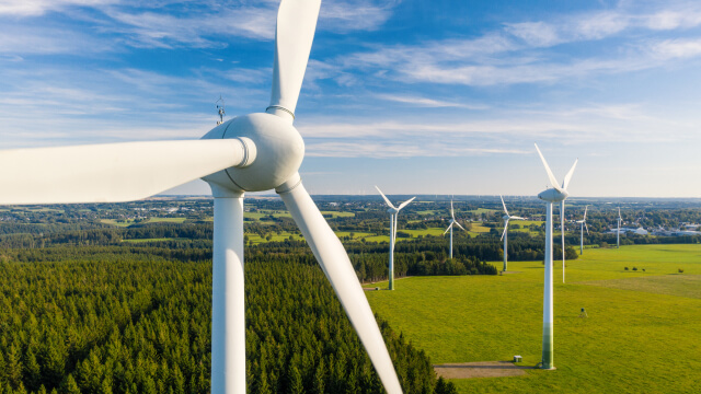 Wind turbines generating power in a green landscape