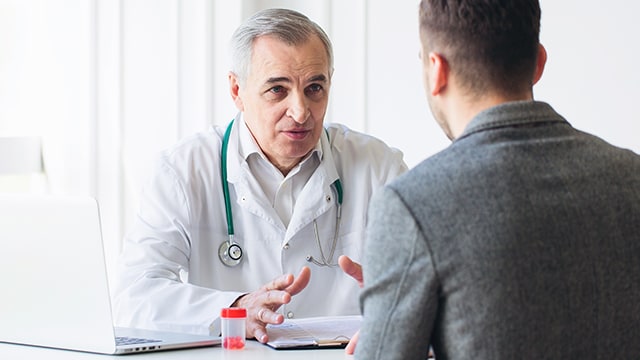 Doctor speaking to patient.