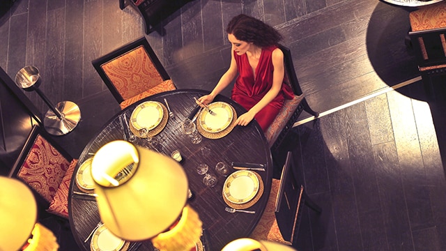 Woman sitting at a table at a restaurant