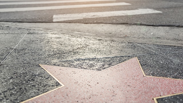 A star in the cement on the sidewalk.