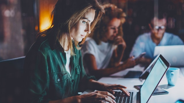 A women working on a computer.