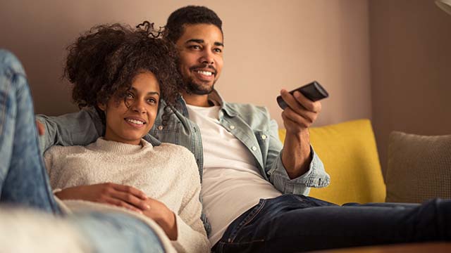 A couple watching tv.