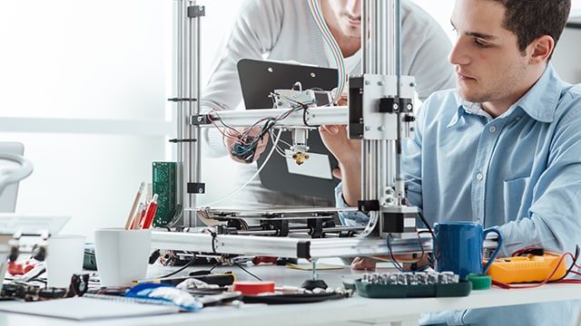 colleagues testing prototype equipment