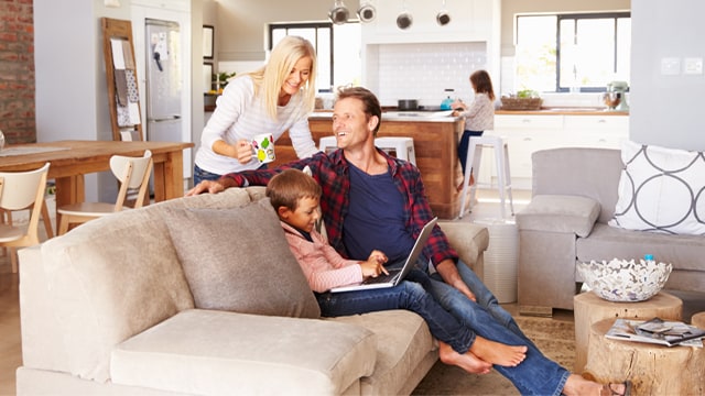 Mom, Dad and kids in a living room