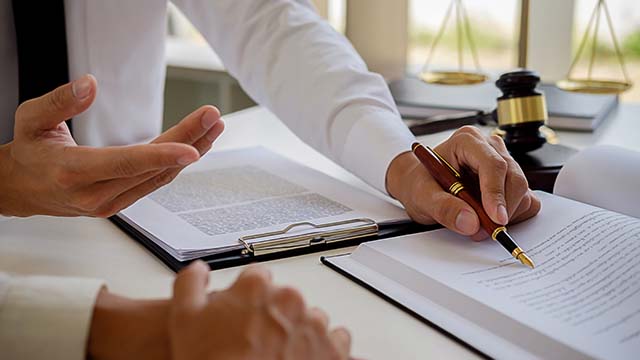 People at table with documents