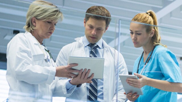 Healthcare workers looking at document