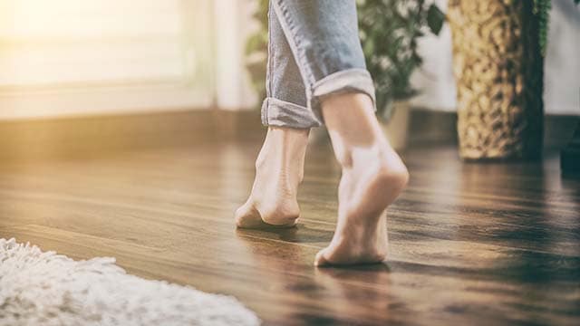 Bare feet on manufactured flooring