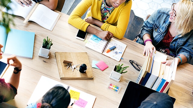 People sitting around a table discussing a topic.