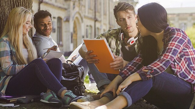 people sitting together going over the notes