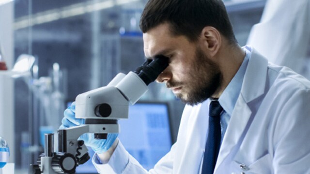 person looking into a scope