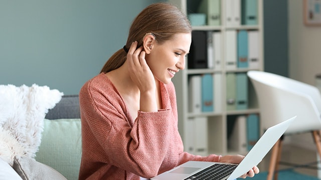 person looking at laptop