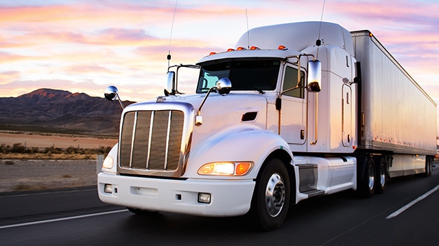 Truck travelling along road