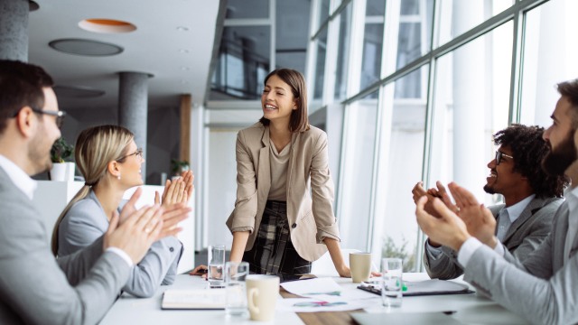 A person speaking with a team