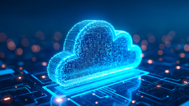 Glowing blue digital cloud representing cloud computing on a circuit board