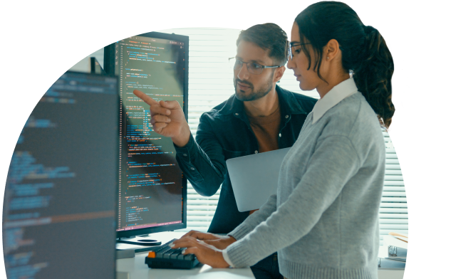 Two people looking at monitor