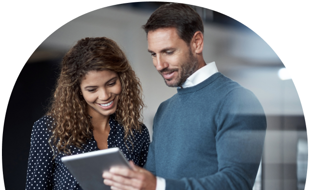 Two people looking at tablet