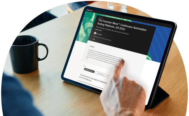 Person viewing Forrester Wave report on tablet