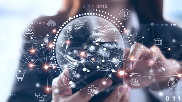 Digital globe on a smartphone screen, connected to icons representing global technology networks