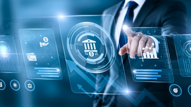 A person touching a digital banking and financial technology interface