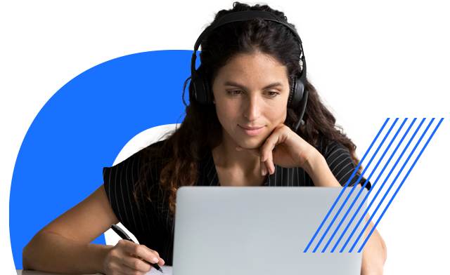 person wearing headphones and working with a laptop