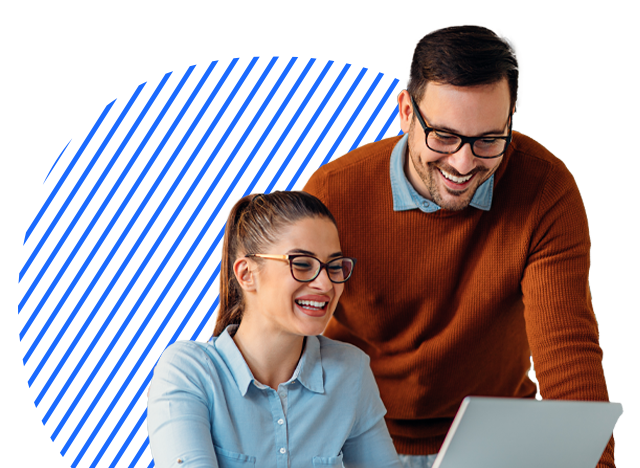 Two colleagues looking at a laptop