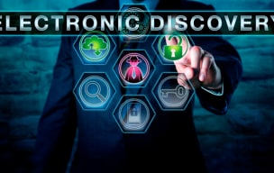 Businessperson touching a digital screen with the words Electronic Discovery