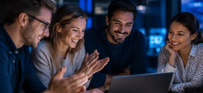 people looking at a laptop
